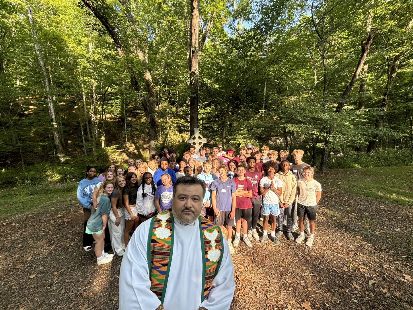 Adam DeLeon, S.J., and students on a freshman retreat at Brebeuf (photo: Amanda Murphy)