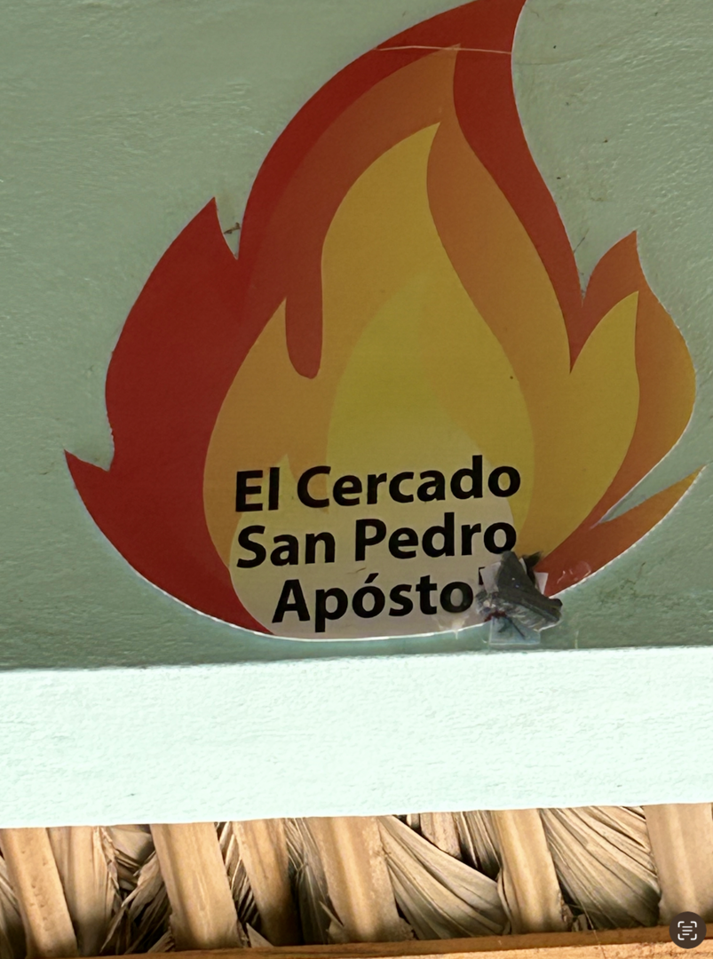 A tongue of fire representing one of the 14 districts at San Pedro Apostol 