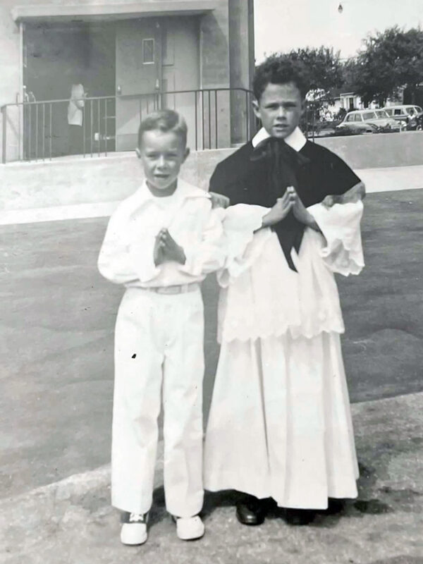 Thomas Reese, left, poses with his brother Edward in front of St. Therese Church in Alhambra, Calif., at Tom’s First Communion. (Photo courtesy of Reese)