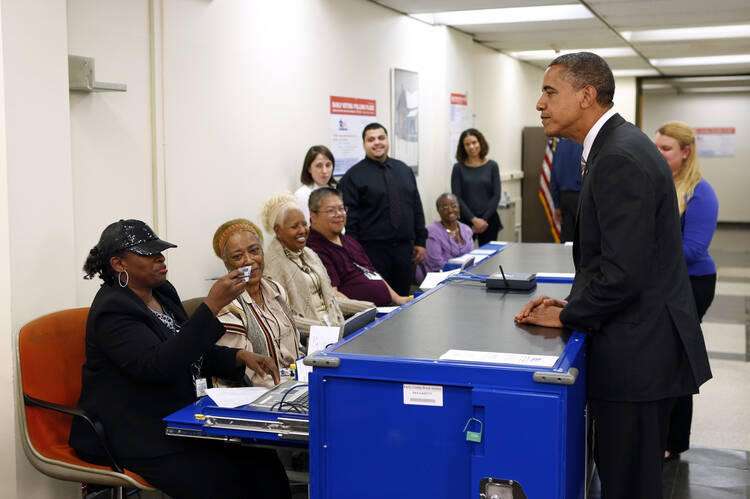 President Obama voting in 2012. (CNS photo/Kevin Lamarque, Reuters)