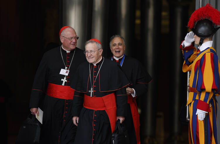 Cardinals Dolan, Kasper and DiNardo leave opening session of Synod of Bishops on the family at Vatican