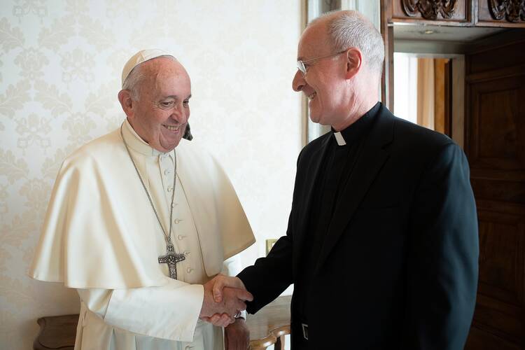 Pope Francis greets Jesuit Father James Martin, author and editor at large of America magazine, during a private meeting at the Vatican Oct. 1, 2019. 
