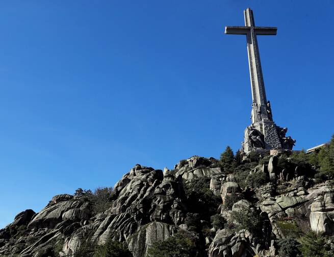 The world's tallest cross dominates the scene above a Spanish Civil War cemetery and memorial in the Valley of the Fallen (renamed the Valley of Cuelgamuros) near Madrid, pictured in October 2019. (CNS photo/Emilio Naranjo, pool via Reuters)
