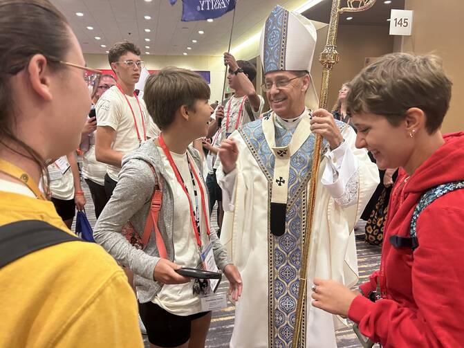Archbishop Charles C. Thompson of Indianapolis greets congress-goers following the final Youth Mass of the National Eucharistic Congress on July 20, 2024. (OSV News photo/Gretchen R. Crowe)
