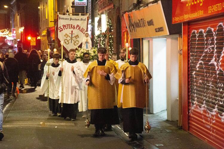 Cork, Ireland’s second-biggest city, is now debating whether to continue beginning city council meetings with a prayer. In this photo from Dec. 8, 2022, a statue of Mary is carried during a procession through the streets of Cork in celebration of the feast of the Immaculate Conception. (CNS photo/Cillian Kelly)