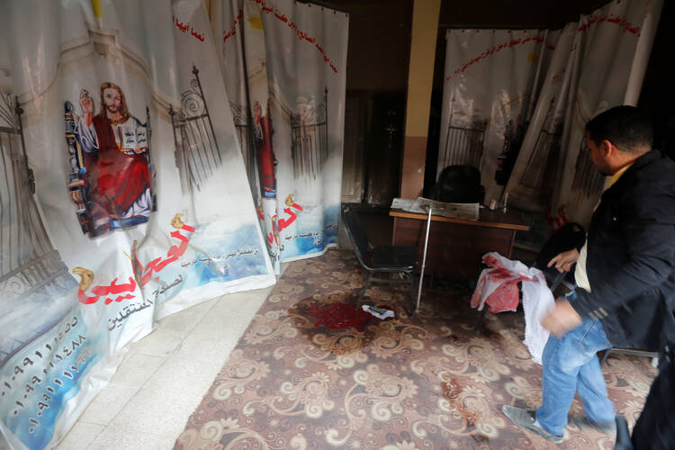 Blood stains are seen Dec. 29 on the floor of the Coptic Orthodox Church of Mar Mina in Helwan, Egypt, near Cairo (CNS photo/Amr Abdallah Dalsh, Reuters).