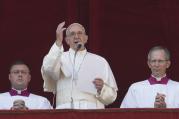 Pope Francis speaks after delivering his Christmas blessing "urbi et orbi" (to the city and the world) from the central balcony of St. Peter's Basilica at the Vatican Dec. 25. (CNS photo/Paul Haring) 