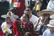 People wave the flags of Mexico and the Vatican as they wait for Pope Francis' arrival to celebrate Mass in Ecatepec near Mexico City Feb. 14. (CNS photo/Paul Haring) 