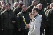 Ukrainian boys in Kiev hold flowers March 16 during a ceremony marking the second anniversary of people killed in the pro-Russian separatist conflict. (CNS photo/Gleb Garanich, Reuters)