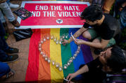 People gather at a June 14 candlelight vigil in Manila, Philippines, in memory of the victims of the mass shooting at a gay nightclub in Orlando, Fla. Philippine Catholic bishops called for vigilance against bullying, ostracism and harassment of gay people in the wake of the incident in which police said a lone gunman killed 49 people early June 12 at the club. (CNS photo/Mark R. Cristino, EPA)