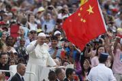 China's flag waves as Pope Francis greets the crowd during his general audience in St. Peter's Square at the Vatican in June. (CNS photo/Paul Haring)