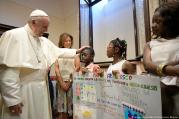 Pope Francis greets young refugees during a conference on families and adolescent education at Rome's Basilica of St. John Lateran on June 19. (CNS photo/L'Osservatore Romano via Reuters)