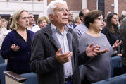 Worshippers recite the Lord's Prayer during Mass at Corpus Christi Church in Mineola, N.Y., on Oct. 13. (CNS photo/Gregory A. Shemitz, Long Island Catholic)