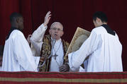 Pope Francis delivers his Christmas blessing "urbi et orbi" (to the city and the world) from the central balcony of St. Peter's Basilica at the Vatican Dec. 25. (CNS photo/Paul Haring)