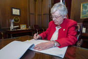 Alabama Gov. Kay Ivey signs into law a bill to ban abortion in nearly all cases at the state Capitol in Montgomery on May 15. (CNS photo/Office of the Governor State of Alabama handout via Reuters)