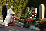 Msgr. Georg Ratzinger and his brother, now-retired Pope Benedict XVI, are seen in 2006 praying at their parents' grave in Pentling, Germany. Msgr. Ratzinger died July 1 at the age of 96. (CNS photo/Wolfgang Radtke, KNA) 