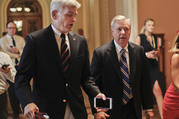 Sen. Bill Cassidy, R-La., left, and Sen. Lindsey Graham, R-S.C., right, talk while walking to a meeting on Capitol Hill in Washington in July. Senate Republicans are planning a final, uphill push to erase President Barack Obama's health care law. But Democrats and their allies are going all-out to stop the drive. (AP Photo/Pablo Martinez Monsivais, File)