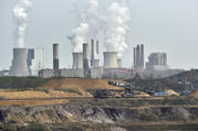 Giant machines dig for brown coal at the open-cast mining Garzweiler in front of a power plant near the city of Grevenbroich in western Germany in April 2014. (AP Photo/Martin Meissner, File)