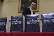 James Knable helps to unpack copies of the President's FY19 Budget after it arrived at the House Budget Committee office on Capitol Hill in Washington, Monday, Feb. 12, 2018. (AP Photo/Susan Walsh)