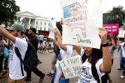 People march outside the White House Aug. 15 at a rally calling on President Donald Trump to protect the Deferred Action for Childhood Arrivals program, known as DACA. (CNS photo/Joshua Roberts, Reuters) 