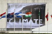 A "Climate" banner is seen hanging from the U.N. General Assembly building in New York City June 30, a day after the U.N. hosted a high-level event on climate change. (CNS photo/Gregory A. Shemitz)