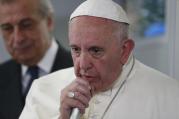 Pope Francis answers questions from journalists aboard his flight from Ciudad Juarez, Mexico, to Rome, Feb. 17 (CNS photo/Paul Haring).