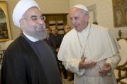 Pope Francis shares a light moment with Iranian President Hassan Rouhani during a private meeting at the Vatican Jan. 26 (CNS photo/Andrew Medichini, pool via Reuters).