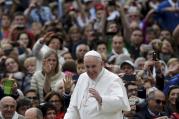 Pope Francis waves as he arrives to lead his weekly audience in St. Peter's Square at the Vatican, Sept. 30 (CNS photo/Max Rossi, Reuters).