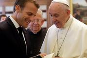 Pope Francis exchanges gifts with French President Emmanuel Macron during a private audience at the Vatican in June 2018. (CNS photo/ Alessandra Tarantino, pool via Reuters)