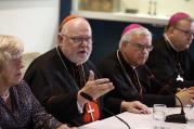 Cardinal Reinhard Marx of Munich-Freising and other German bishops and a lay synod observer, hold a press conference at the Vatican after the opening session of the Synod of Bishops on the family at the Vatican, Oct. 6 (CNS photo/Paul Haring).