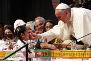 Pope Francis greets a young girl as he participates in the second World Meeting of Popular Movements in Santa Cruz, Bolivia, July 9 (CNS photo/Paul Haring).