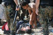 BORDER PRESS. Exhuastion at an attempted crossing between Macedonia and Greece, near the town of Gevgelija, Macedonia.