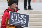 A young woman with Students for Life holds a sign outside the U.S. Supreme Court prior to the Women's March on Washington Jan. 21. (CNS photo/Bob Roller)