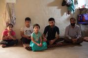 A Yazidi family in a temporary shelter in Iraq. (Kevin Clarke)